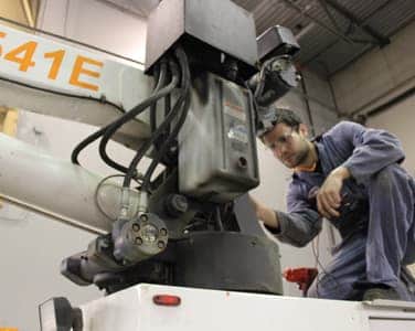 mechanic servicing a work truck